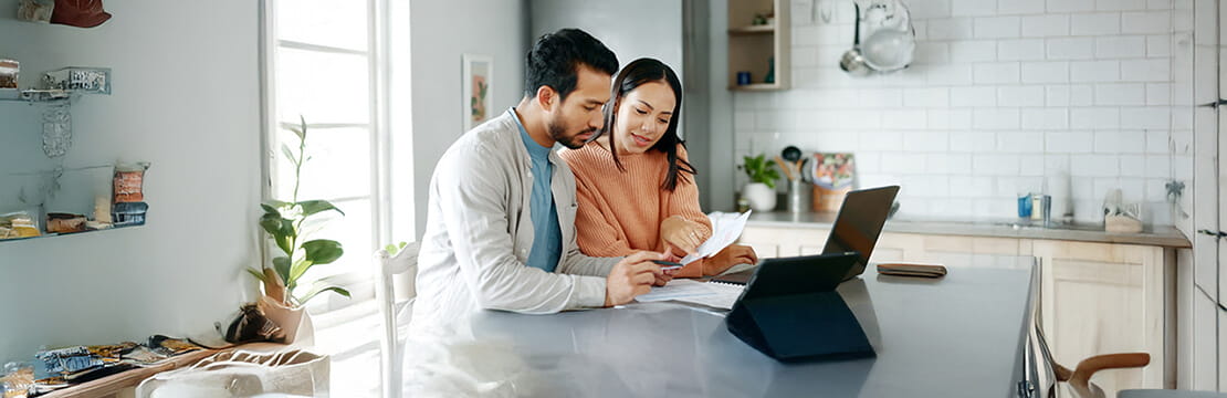 A couple looking at the laptop screen